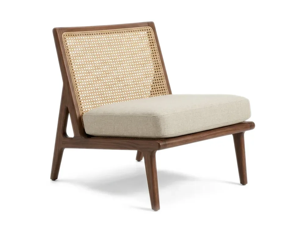 Walnut lounge chair with a cane back and linen cushion